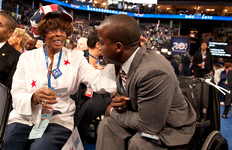 Two people talking during the Democratic National Convention.