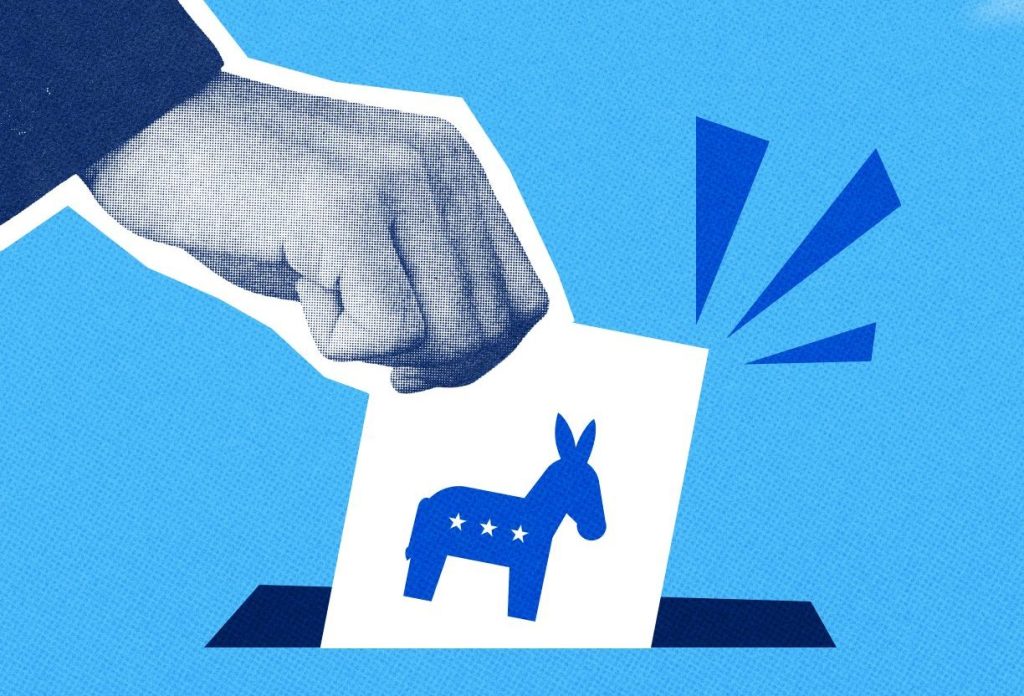 An illustration of a hand placing a white ballot featuring a blue Democratic donkey logo into a ballot box against a textured blue background.